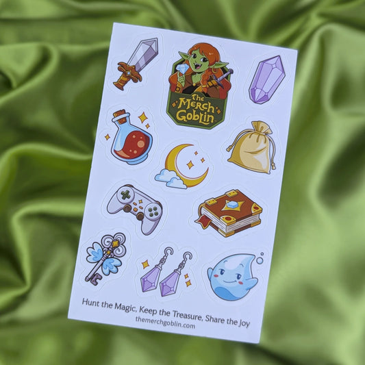 Sheet of fantasy themed stickers including a sword, purple gem, potion bottle, moon game controller, magical book, sparkling jewelry, cute water sprite, flying key, a gold bag, and The Merch Goblin logo