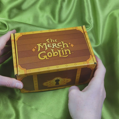 Video of a treasure chest themed gift box with gold satin pouch, card, and envelope with gold seal