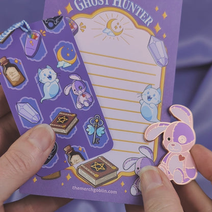 Video of a purple ghost hunter themed notepad, bookmark, and patchwork bunny bundle.