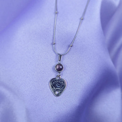 Stainless steel necklace with heart-shaped spirit board pendant and purple amethyst gemstone